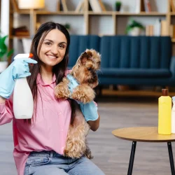 a-pretty-woman-wearing-rubber-gloves-holds-her-sma-2026-01-09-06-43-03-utc